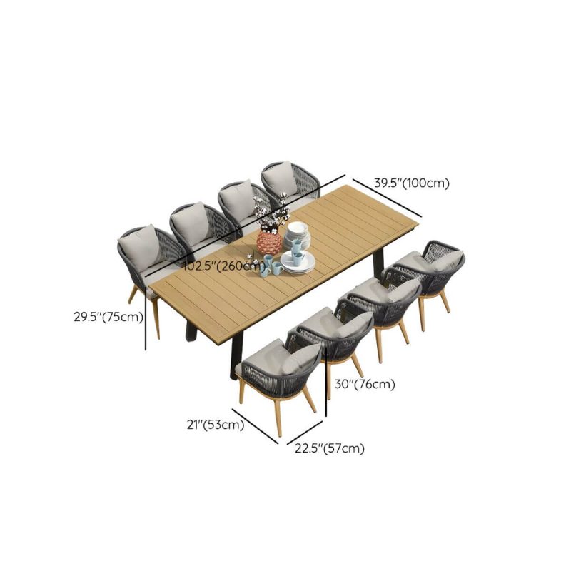 "Dimension of Modern Black Patio Dining Set: Metal Frame, Upholstered White Cushions, Leaf Not Included - Table & 8 Chairs 102.4"L x 39.4"W x 29.5"H"