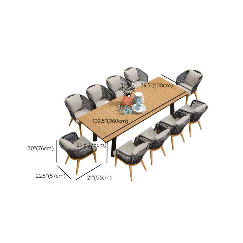 "Dimension of Modern Black Patio Dining Set: Metal Frame, Upholstered White Cushions, Leaf Not Included - Desk & 10 Chairs 102.4"L x 39.4"W x 29.5"H"
