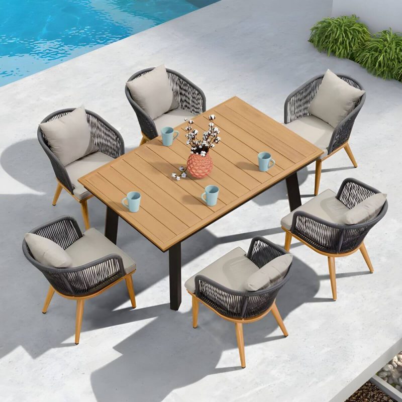 "Modern Black Patio Dining Set: Metal Frame, Upholstered White Cushions, Leaf Not Included - Table & 6 Chairs 61"L x 39"W x 30"H"